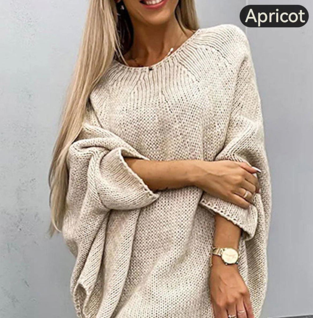 Elegant women's knitted sweater with cape