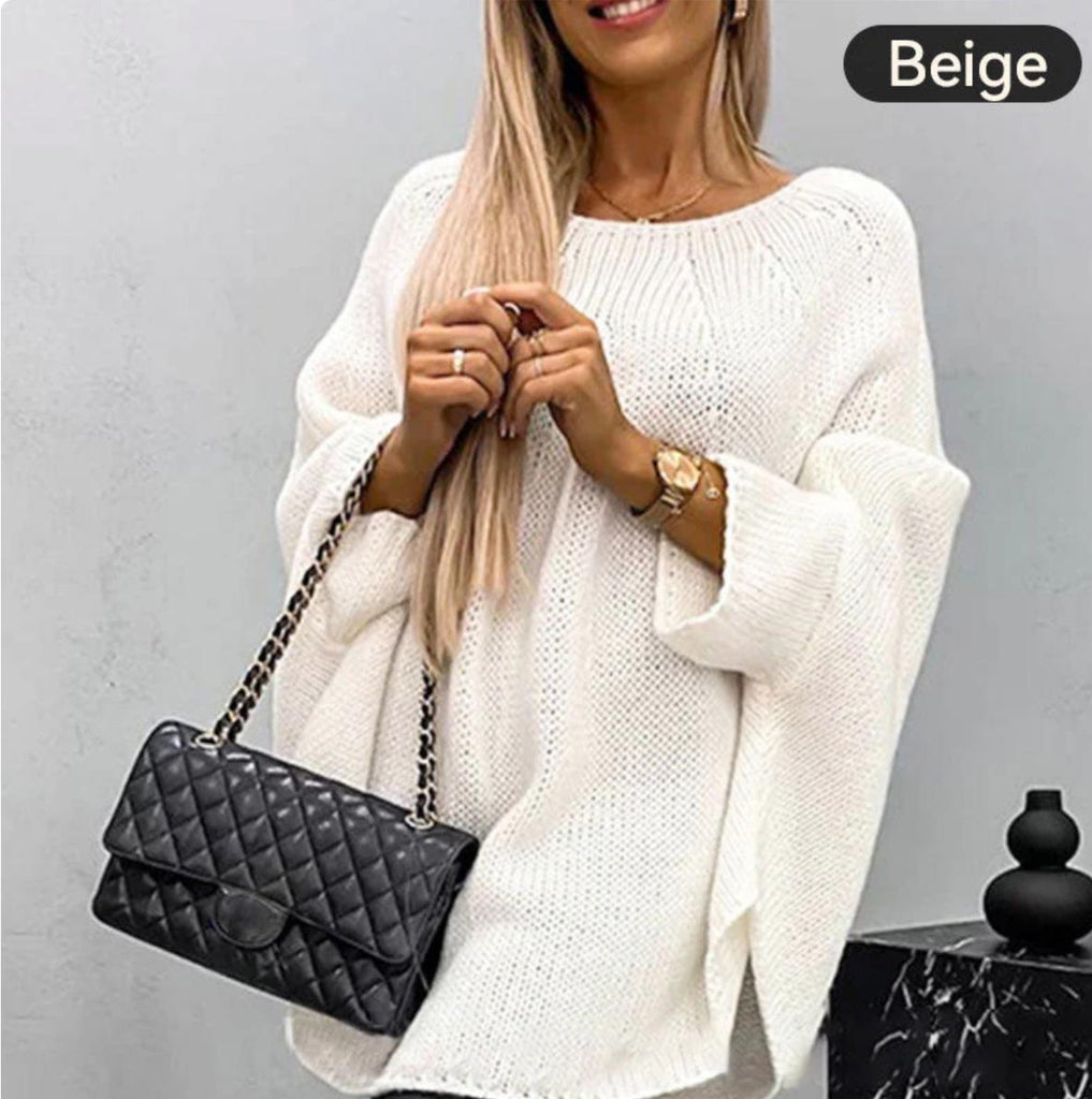 Elegant women's knitted sweater with cape