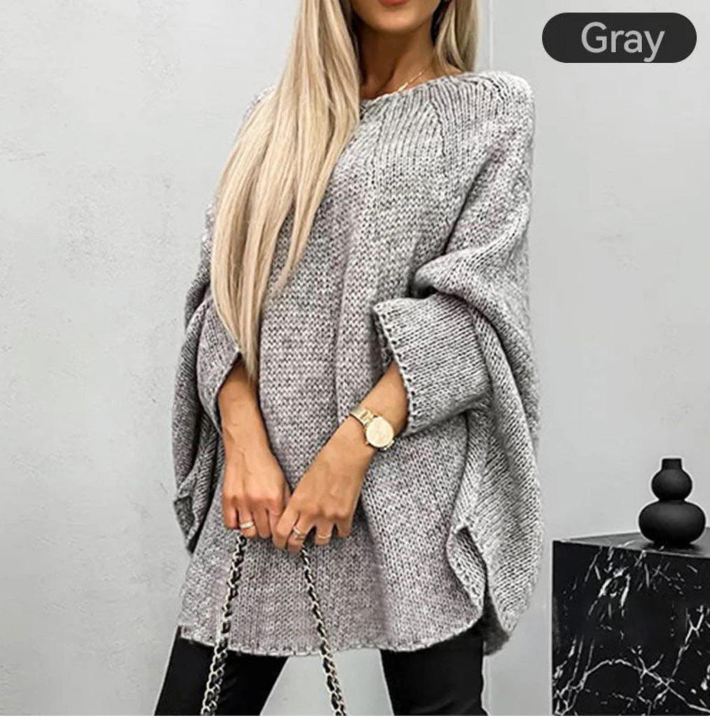 Elegant women's knitted sweater with cape